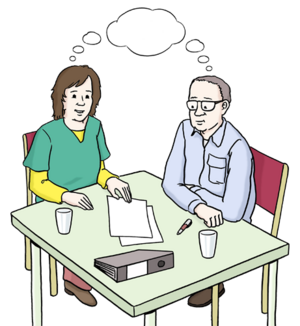 Zwei Menschen sitzen an einem Tisch. Zwischen ihnen eine leere Sprechblase. Auf dem Tisch liegen Zettel, ein Stift und ein Aktenordner